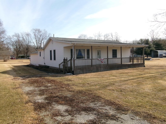 ranch-style house with covered porch and a front lawn