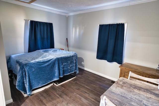 bedroom featuring ornamental molding and dark hardwood / wood-style floors