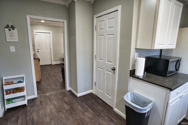 kitchen with white cabinetry and dark hardwood / wood-style flooring