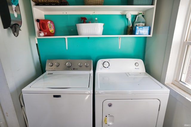 laundry room featuring washing machine and clothes dryer