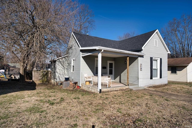 view of side of home with a patio area and a lawn