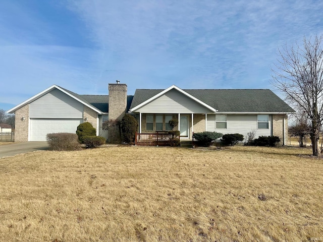 ranch-style home with a garage, a front lawn, and a porch