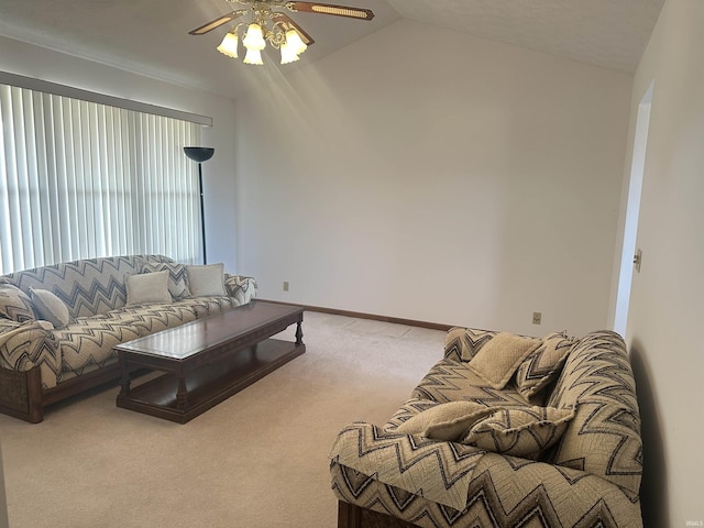 carpeted living room with lofted ceiling and ceiling fan