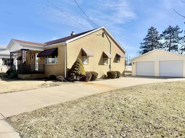 view of side of property with an outbuilding and a garage