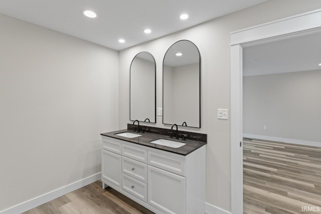 bathroom with vanity and hardwood / wood-style flooring