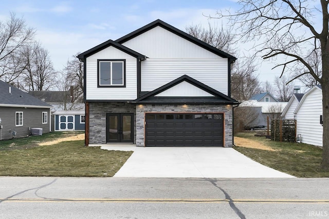 view of front of home featuring central AC and a front yard