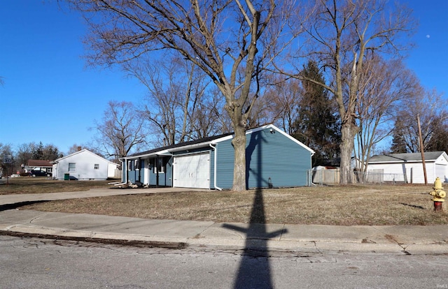 view of front of house with a garage and a front yard