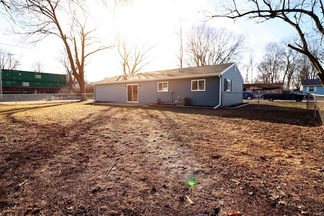 back of property featuring central AC unit