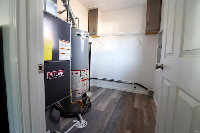 utility room with heating unit and gas water heater