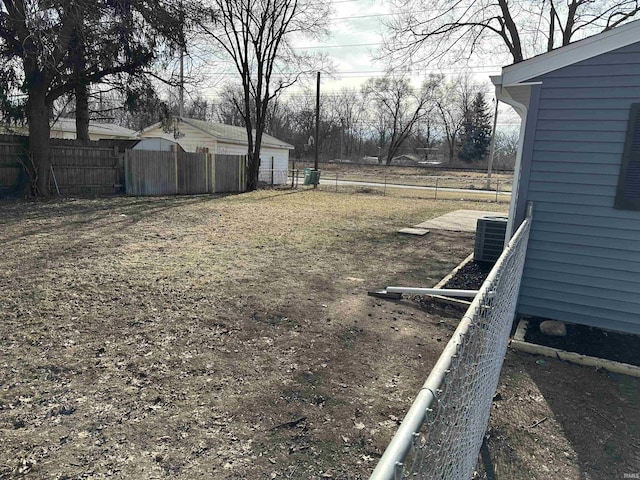 view of yard with central air condition unit