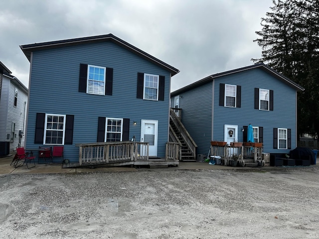 back of house with a patio and central AC unit