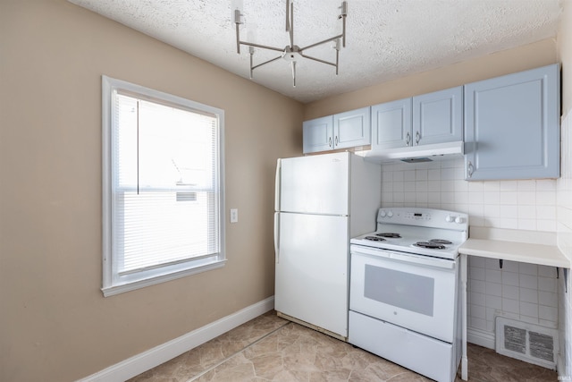 kitchen with tasteful backsplash, a textured ceiling, and white appliances