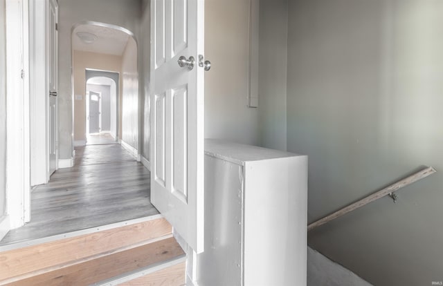 stairway featuring wood-type flooring