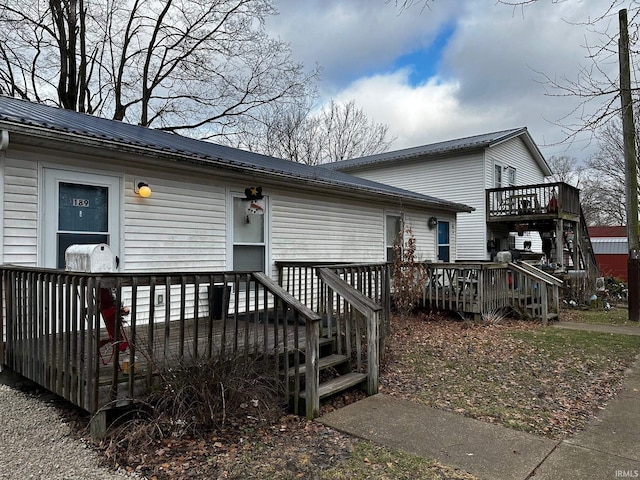 view of front of home featuring a wooden deck