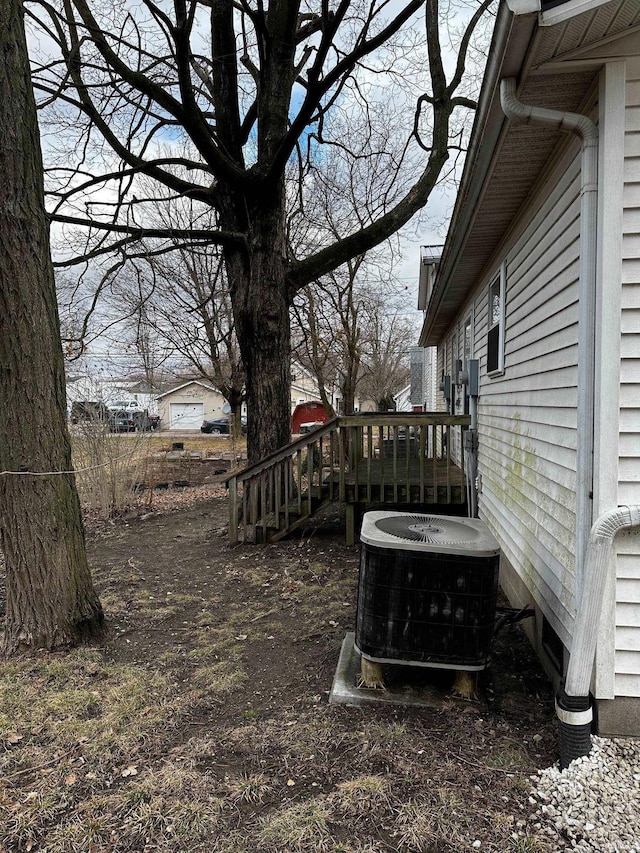 view of yard featuring central air condition unit