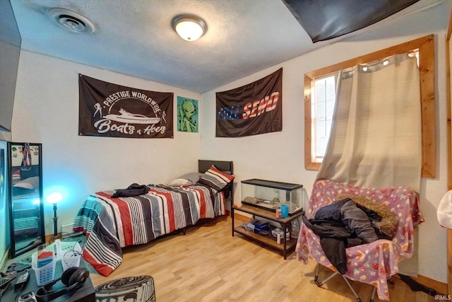 bedroom featuring wood-type flooring