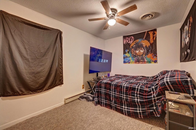 carpeted bedroom with ceiling fan, a baseboard heating unit, and a textured ceiling