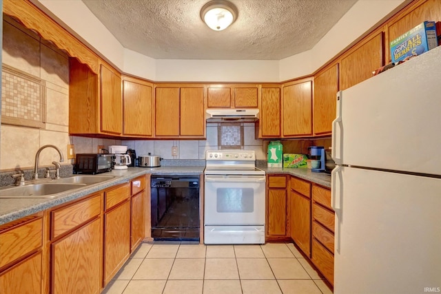 kitchen with sink, tasteful backsplash, a textured ceiling, light tile patterned floors, and white appliances