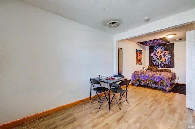 bedroom with wood-type flooring