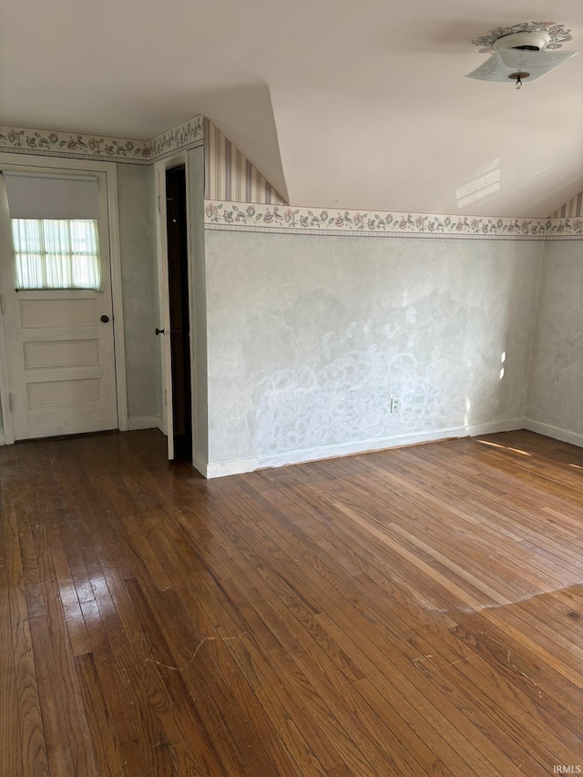 additional living space featuring hardwood / wood-style flooring