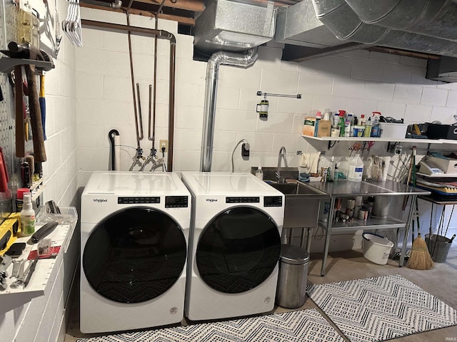 washroom featuring separate washer and dryer and sink