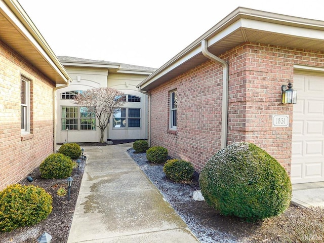 entrance to property featuring a garage