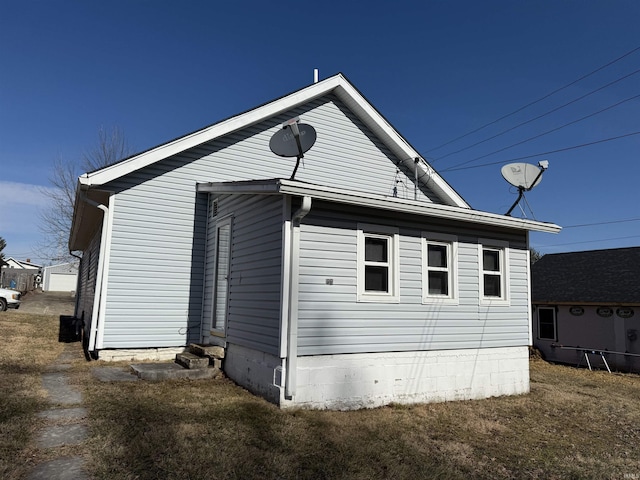 view of home's exterior featuring a yard