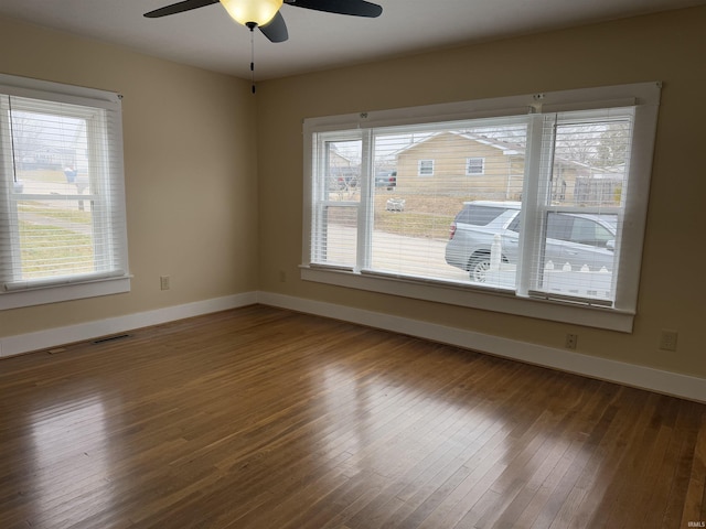 unfurnished room with ceiling fan and wood-type flooring