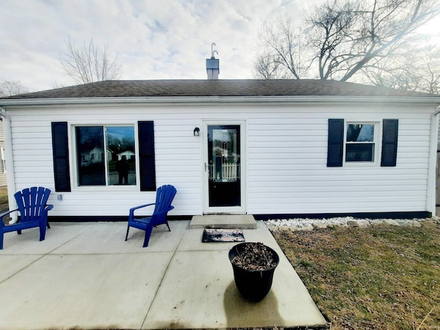 rear view of property featuring a patio area