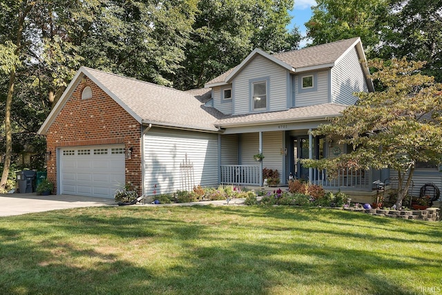 view of front of house featuring a porch, a garage, and a front lawn