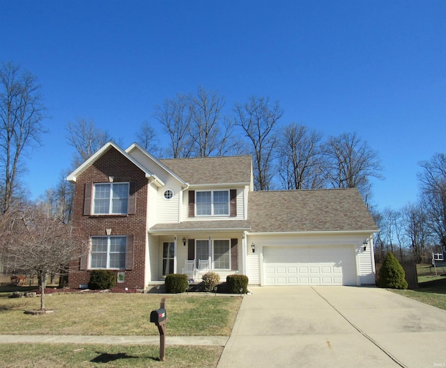 view of front of property with a garage and a front yard