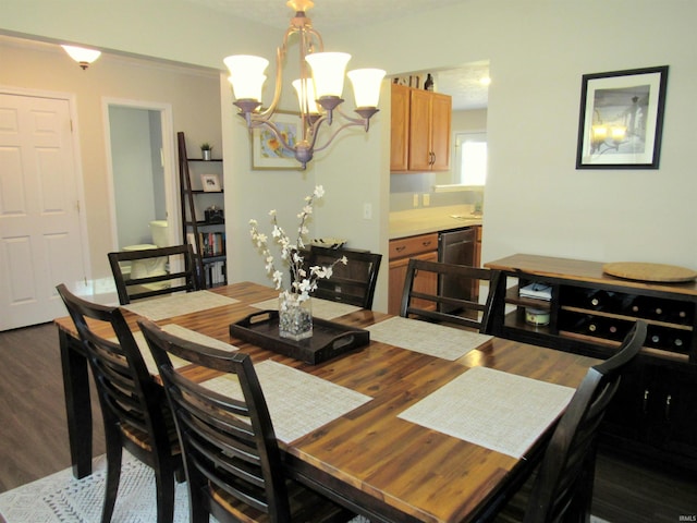 dining space with dark hardwood / wood-style flooring and a notable chandelier