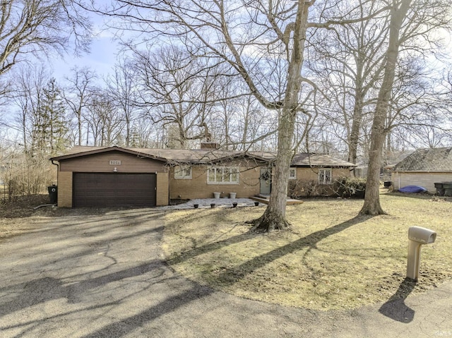 ranch-style home featuring a garage