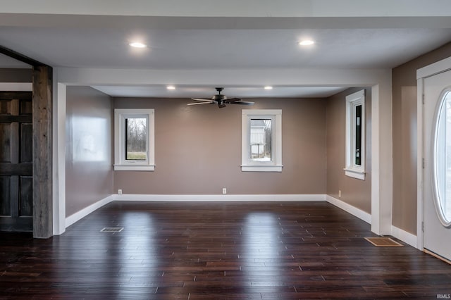 entryway featuring ceiling fan, a healthy amount of sunlight, and dark hardwood / wood-style flooring