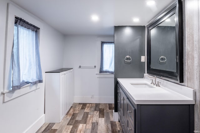 bathroom featuring wood-type flooring and vanity