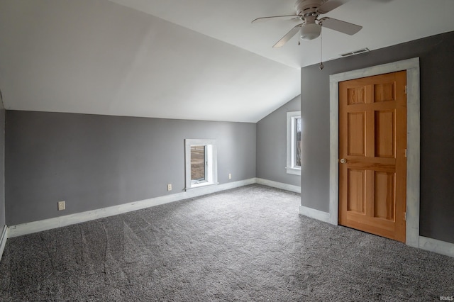 additional living space featuring lofted ceiling, carpet floors, and ceiling fan