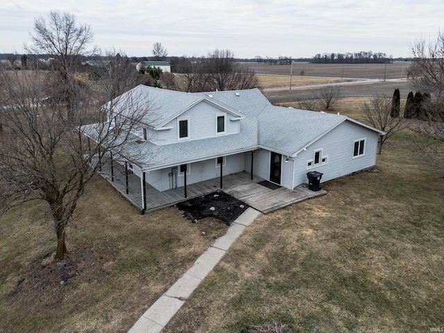 birds eye view of property with a rural view