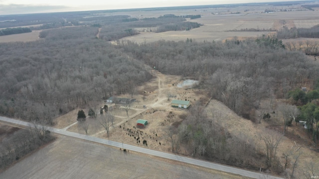 birds eye view of property featuring a rural view