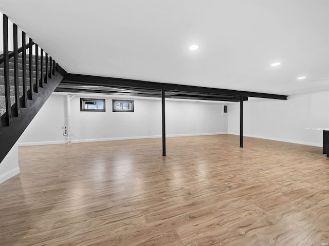 basement featuring light hardwood / wood-style floors