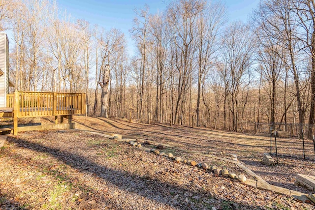 view of yard featuring a wooden deck