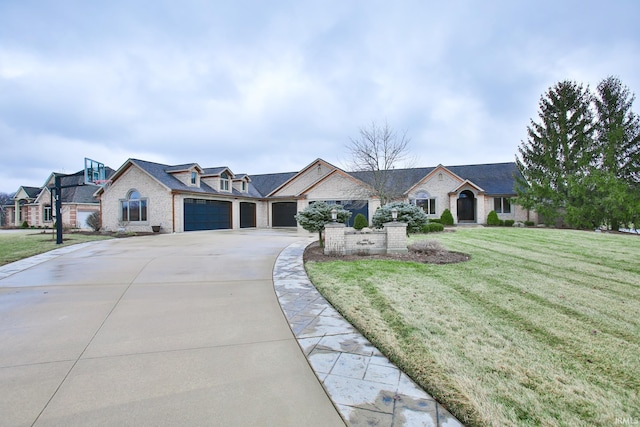 ranch-style home featuring a garage and a front lawn