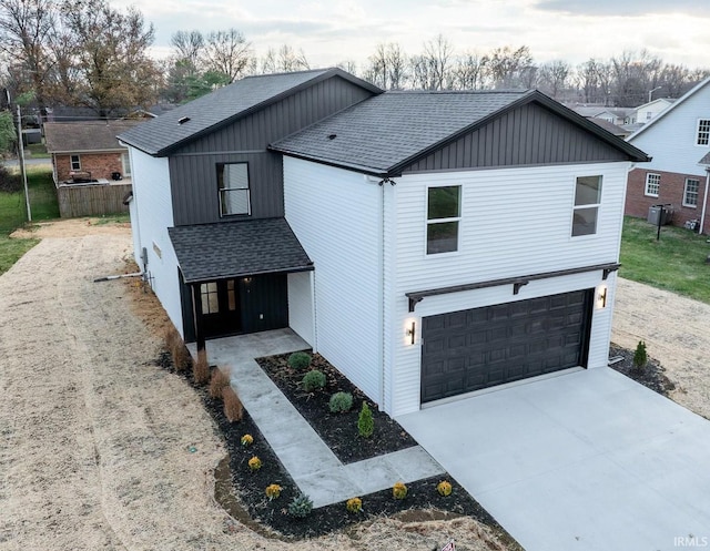 modern farmhouse style home with a garage