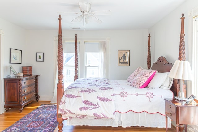 bedroom featuring hardwood / wood-style floors and ceiling fan