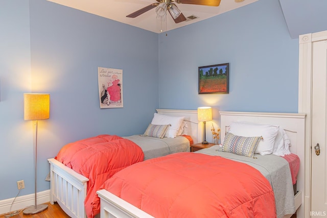 bedroom featuring ceiling fan and light hardwood / wood-style flooring