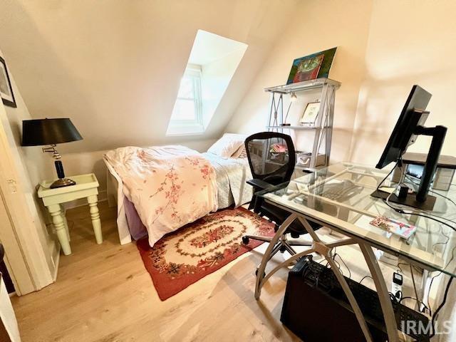 bedroom with light wood-type flooring