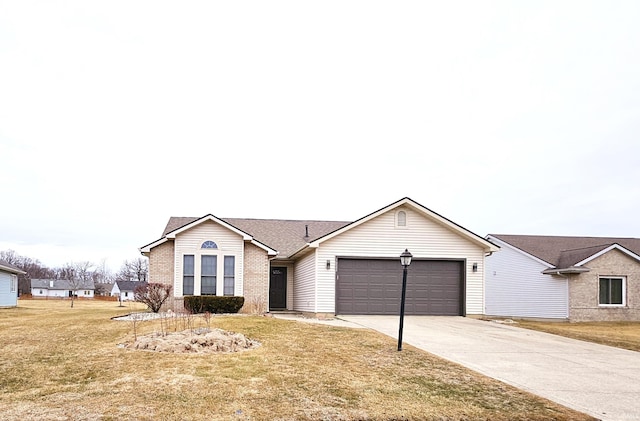 ranch-style home featuring a garage and a front lawn