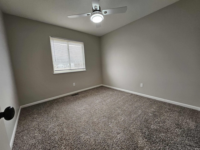 carpeted empty room with ceiling fan