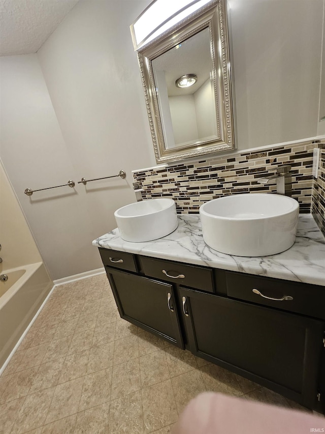 bathroom with vanity and backsplash