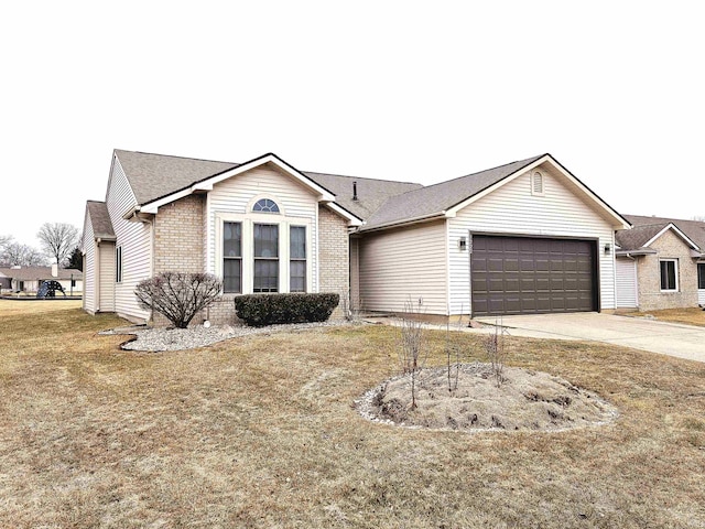 ranch-style home featuring a garage and a front yard