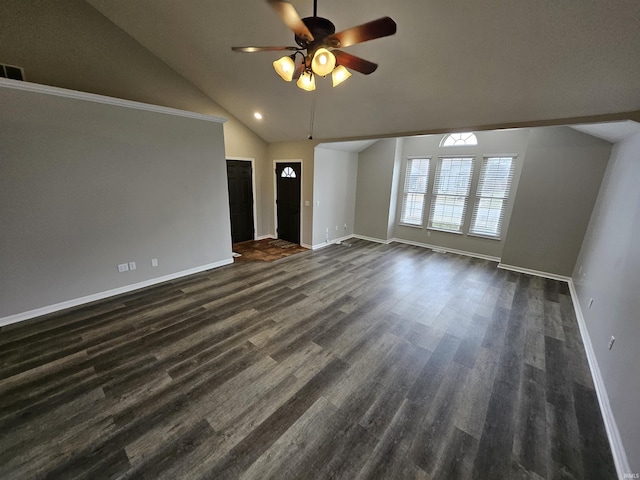 unfurnished living room featuring lofted ceiling, dark wood-type flooring, and ceiling fan